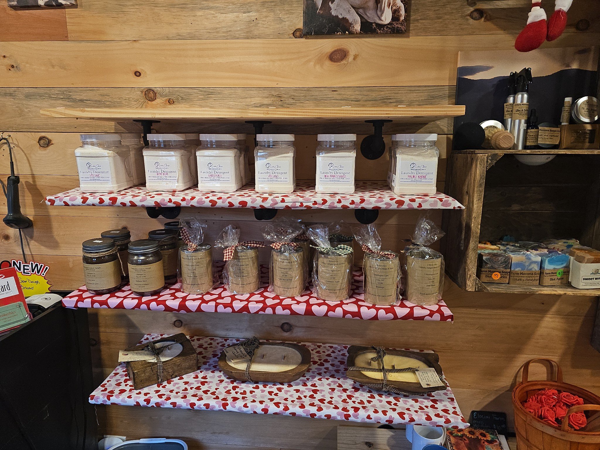Fresh farm eggs in a carton featuring various colors, including brown, white, and cream, resting on a rustic wooden surface. Ideal for cooking and baking.